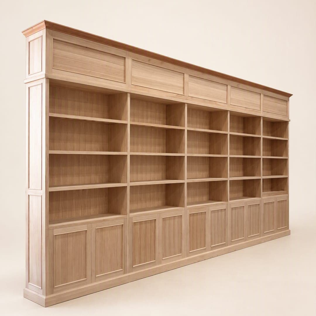 A long timber library wall: open shelves above a run of panelled cupboards